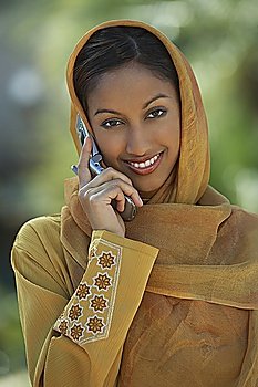 Portrait of muslim woman talking on mobile