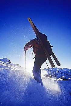 Skier Climbing Slope
