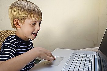 Little Boy Using a Laptop