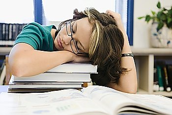 High School Student Sleeping in Library