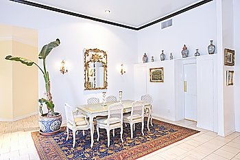 Dining table on patterned rug