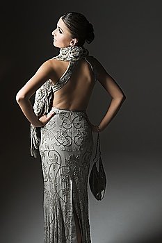 Rear view of woman in backless dress