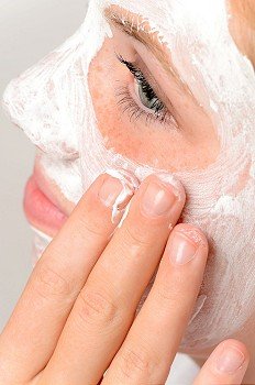 Applying mask fingers young girl beauty treatment skin purity