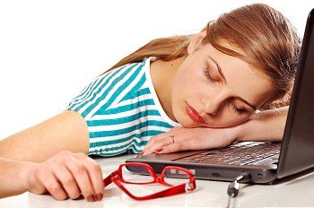 girl sleeping on her laptop