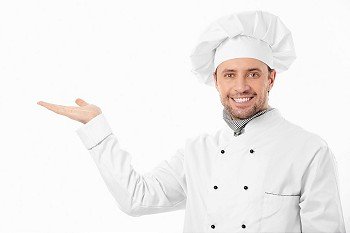 A smiling cook shows his hand on a white background