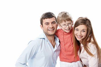 Laughing family on a white background