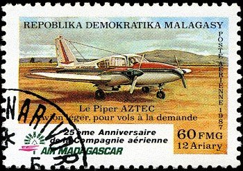 REPUBLICA MALAGASY - CIRCA 1987: A stamp printed in Malagasy (Madagascar) shows plane Aztec, circa 1987