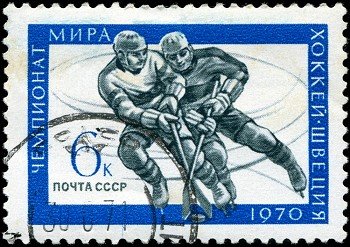USSR - CIRCA 1970: A stamp printed in USSR, hockey, two athletes play hockey, circa 1970