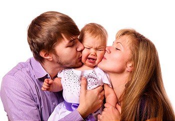 happy family with baby on white background