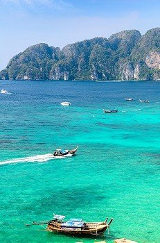 boats, sea and cliffs at koh Phi-Phi, Thailand