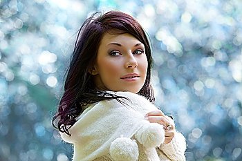 closeup of a brunette in a winter day outside in the park
