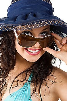 portrait of young woman with sunglasses and blue hat