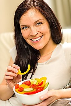 Portrait of woman eating healthy salad