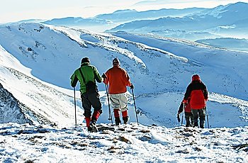 hikers in winter mountain