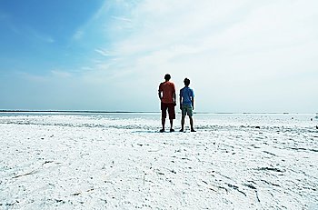 Men and boy on salt lake