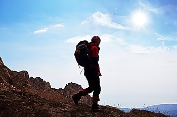 Backpacker in  mountains