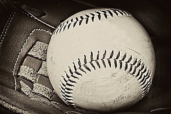 Vintage retro image of baseball and glove in old antique plate style of photograph
