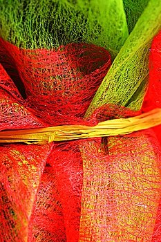 Decorative gossamer and red netting fabric used for wrapping flower