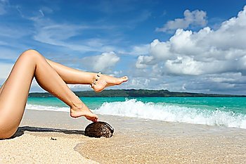 Women´s beautiful legs on the beach