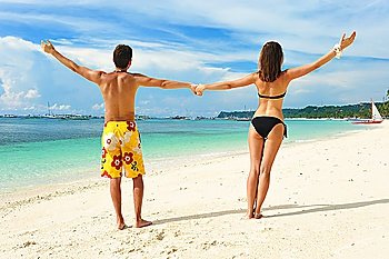 Beautiful couple on a tropical beach