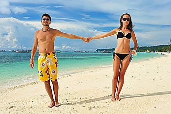 Beautiful couple on a tropical beach