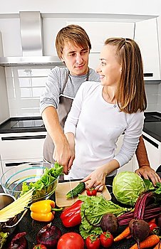 Couple cooking in modern kitchen