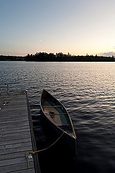 Canoe moored at a dock, Lake of the Woods, Ontario, Canada