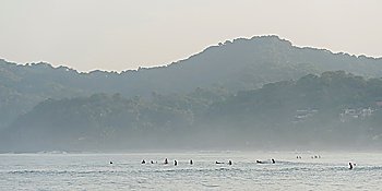 Tourists enjoying surfing in the sea, Sayulita, Nayarit, Mexico