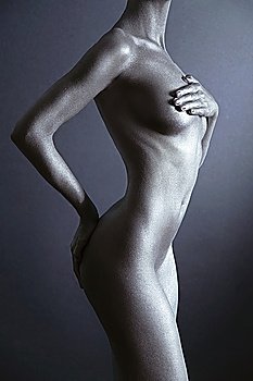 Photo of nude elegant woman with silver bodyart