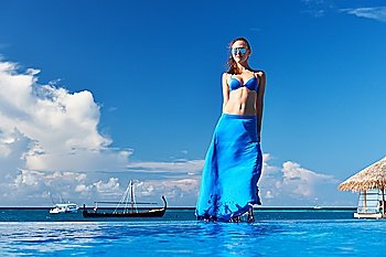 Woman in skirt at the pool