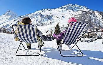 Couple at mountains in winter, Val-d´Isere, Alps, France
