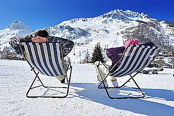 Couple at mountains in winter, Val-d´Isere, Alps, France
