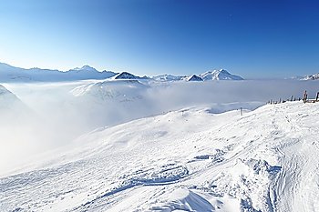 Mountains in clouds with snow in winter, Val-d´Isere, Alps, France