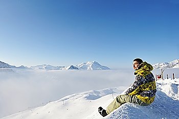 Man at mountains in clouds, Val-d´Isere, Alps, France