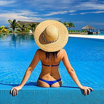 Woman in hat at the pool