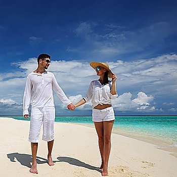 Couple on a tropical beach at Maldives