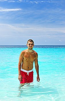 Man in water at tropical beach