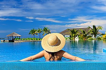 Woman in hat at the pool