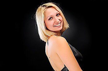 Sexy blonde posing over dark background