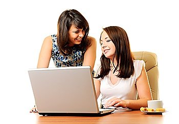 Two young businesswoman with laptop isolated over white