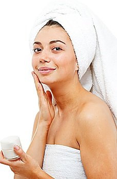 Beautiful women applying moisturizer cosmetic cream on face. Isolated over white.