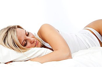 woman sleeping on her bed at home