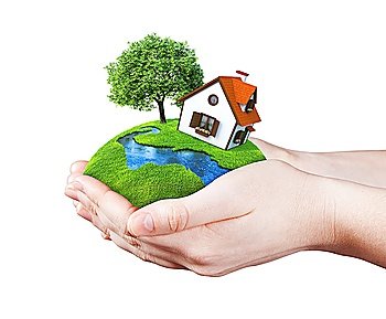 Hands holding house on clear green meadow, tree and river. Concept for growing business, ecology, freshness, freedom and other lifestyle issues. Green fields collection.