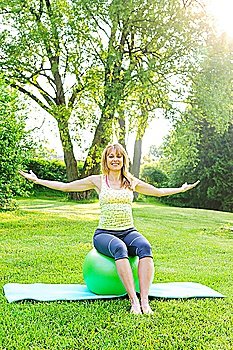 Woman on yoga balance ball