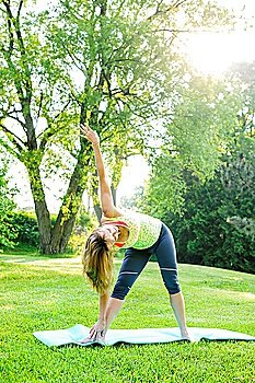 Woman in yoga triangle pose
