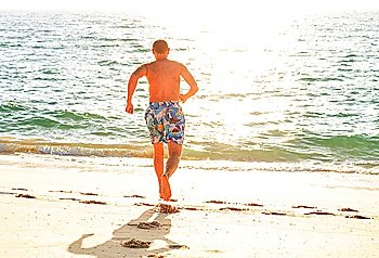 Man on oceanic beach