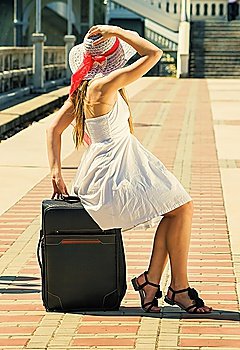 young girl with a suitcase