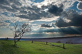 Beautiful countryside landscape across rolling hills with lovely cloud formations