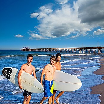 Boys surfers group coming out from Newport beach California