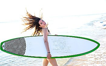 Surf beautiful girl with green surfboard in beach shore